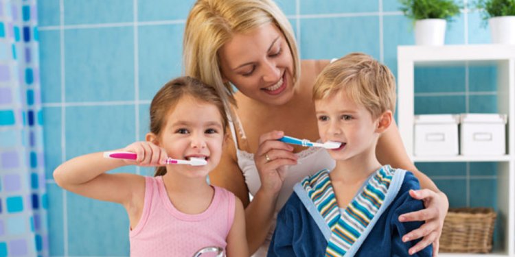 Children brushing teeth